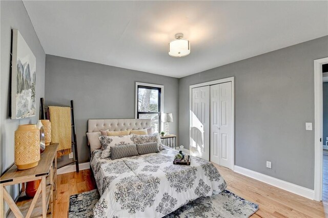 bedroom featuring light hardwood / wood-style flooring and a closet