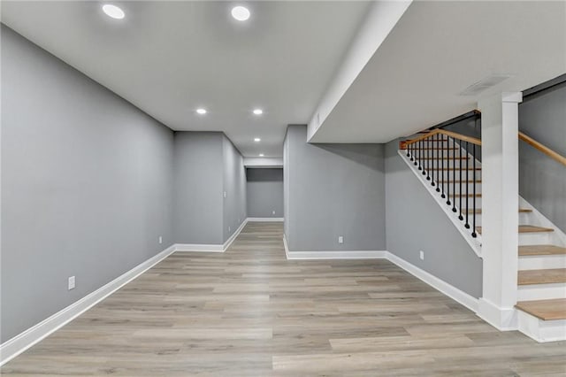 basement featuring light hardwood / wood-style floors