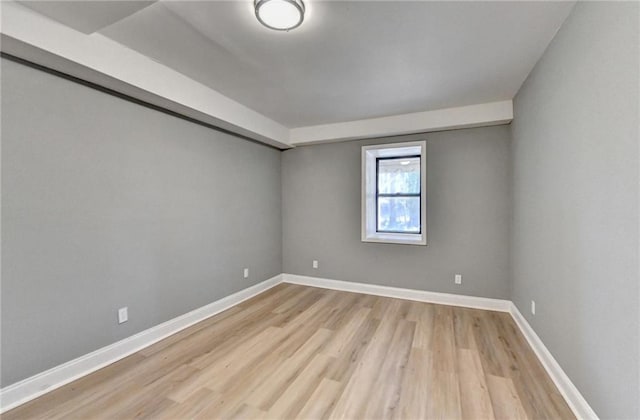 spare room featuring light hardwood / wood-style floors