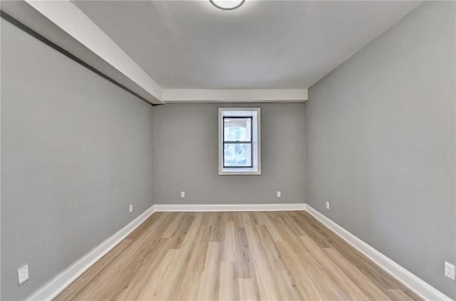 empty room with light hardwood / wood-style floors