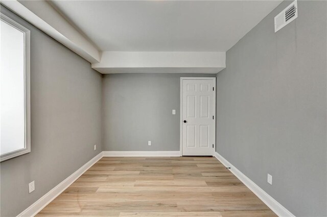 basement featuring light wood-type flooring