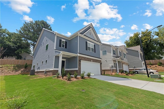 view of front of property featuring central AC, a garage, and a front lawn