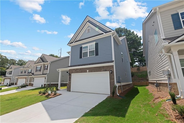 view of front facade with a garage and a front lawn