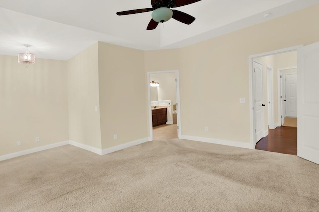 spare room featuring carpet floors and ceiling fan