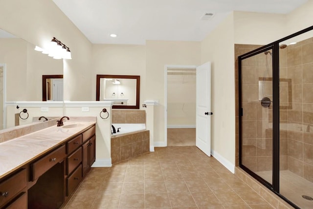 bathroom featuring vanity, tile patterned floors, and independent shower and bath