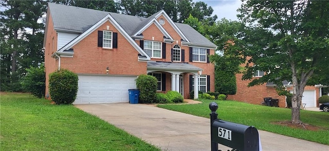571 Cold Water Ln, Mcdonough, GA 30252 - traditional home featuring concrete driveway, a front lawn, an attached garage, and brick siding