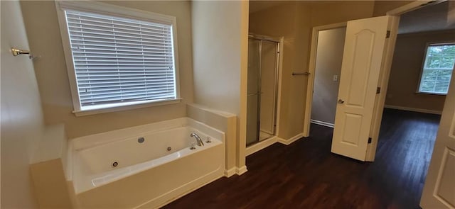 571 Cold Water Ln, Mcdonough, GA 30252 - full bathroom with wood finished floors, a jetted tub, and a shower stall