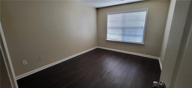 571 Cold Water Ln, Mcdonough, GA 30252 - empty room featuring dark wood-style flooring and baseboards