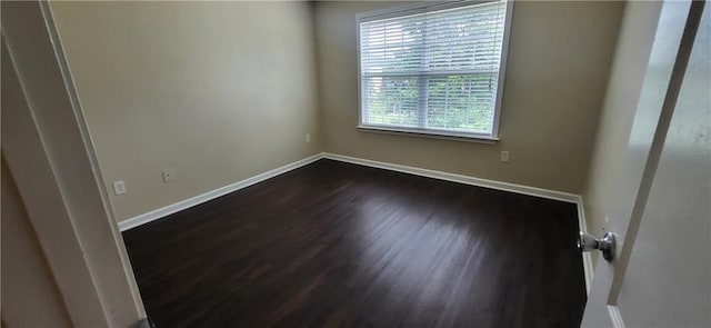 571 Cold Water Ln, Mcdonough, GA 30252 - unfurnished room with baseboards and dark wood finished floors