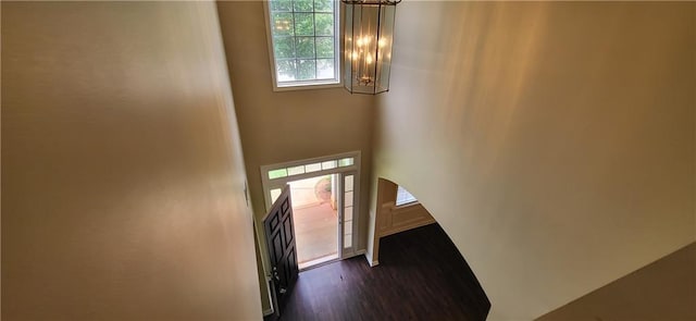 571 Cold Water Ln, Mcdonough, GA 30252 - entryway with a chandelier, dark wood-style flooring, and a towering ceiling
