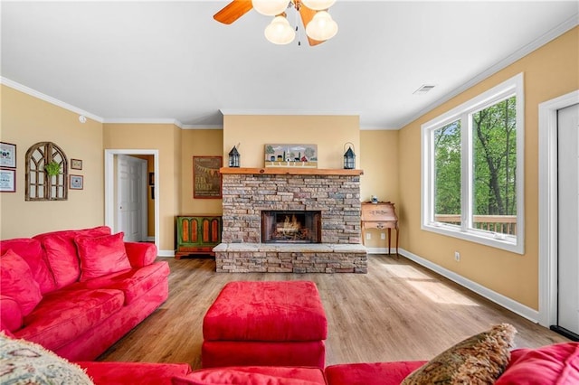 3756 Monument Rd, Jasper, GA 30143 - living area with crown molding, wood finished floors, baseboards, a stone fireplace, and ceiling fan