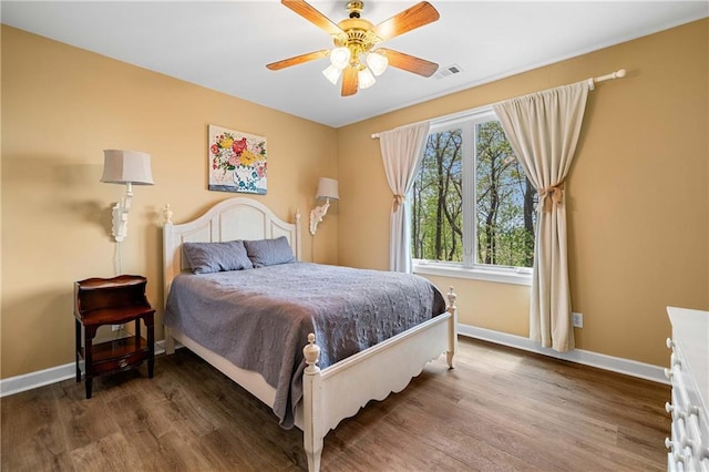 3756 Monument Rd, Jasper, GA 30143 - bedroom with baseboards, wood finished floors, and a ceiling fan