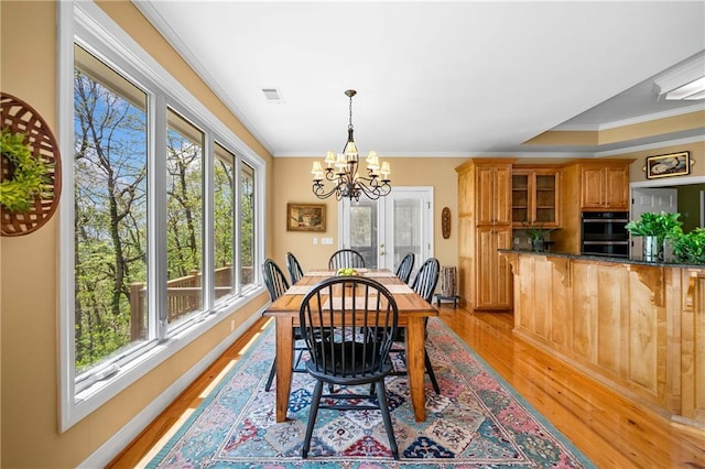 3756 Monument Rd, Jasper, GA 30143 - dining space featuring a chandelier, light wood finished floors, crown molding, and baseboards