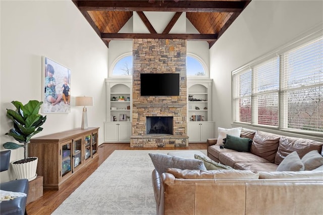mudroom featuring a wainscoted wall, crown molding, and wood finished floors