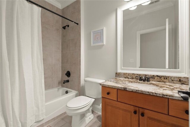 full bathroom with tile patterned floors, toilet, shower / tub combo with curtain, and vanity