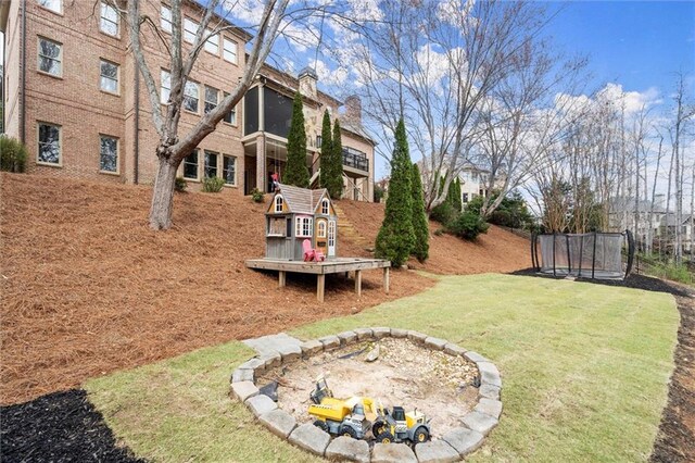 view of yard featuring a trampoline