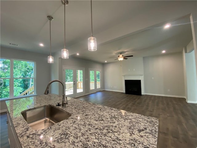kitchen featuring a sink, ceiling fan, dark wood-style flooring, healthy amount of natural light, and recessed lighting
