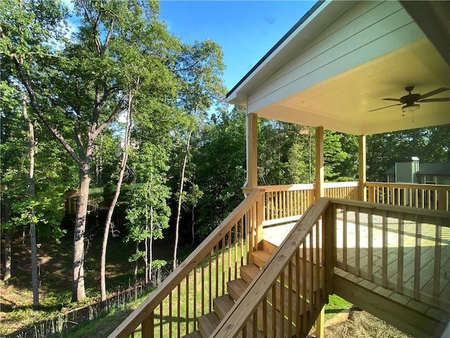 wooden terrace with ceiling fan and stairs