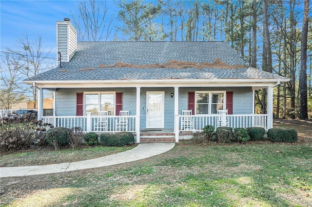 view of front of house featuring a front lawn and a porch