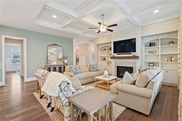 living room featuring dark hardwood / wood-style floors, coffered ceiling, beam ceiling, and built in features