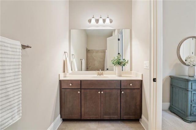 bathroom featuring tile patterned flooring and vanity