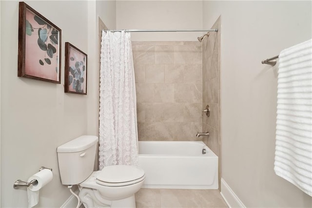 bathroom featuring tile patterned floors, toilet, and shower / bath combo with shower curtain