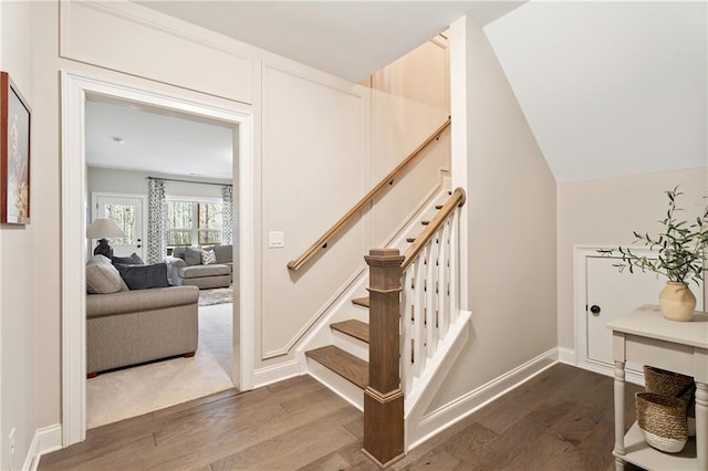 stairs featuring hardwood / wood-style flooring