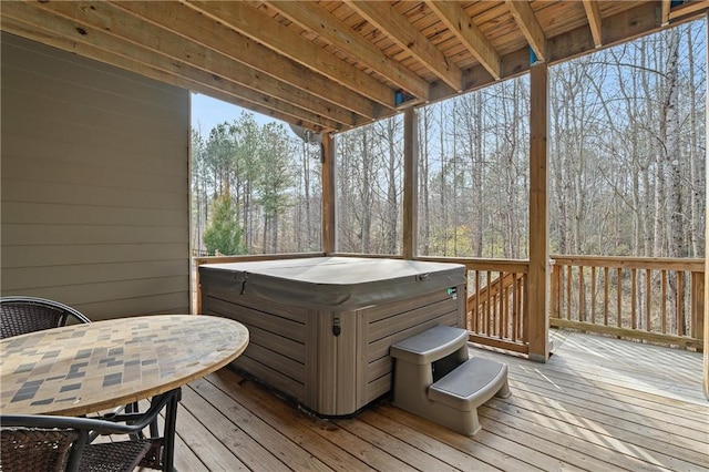 deck featuring a hot tub