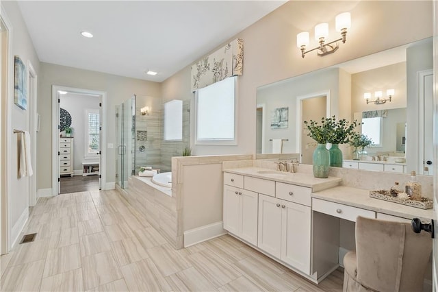 bathroom featuring plus walk in shower and vanity