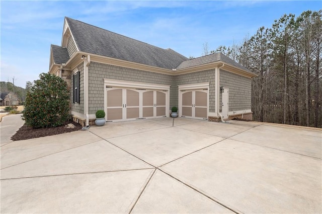 view of property exterior with a garage