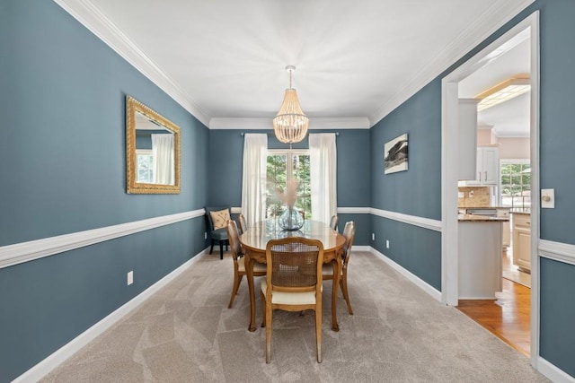 120 Ashewoode Downs Ln, Alpharetta, GA 30005 - dining area featuring a chandelier, crown molding, and light carpet