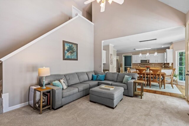 120 Ashewoode Downs Ln, Alpharetta, GA 30005 - living area with light colored carpet, high vaulted ceiling, and ceiling fan