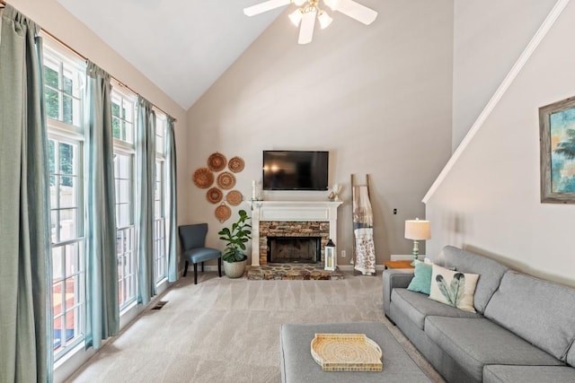 120 Ashewoode Downs Ln, Alpharetta, GA 30005 - living room with a stone fireplace, high vaulted ceiling, light carpet, and ceiling fan