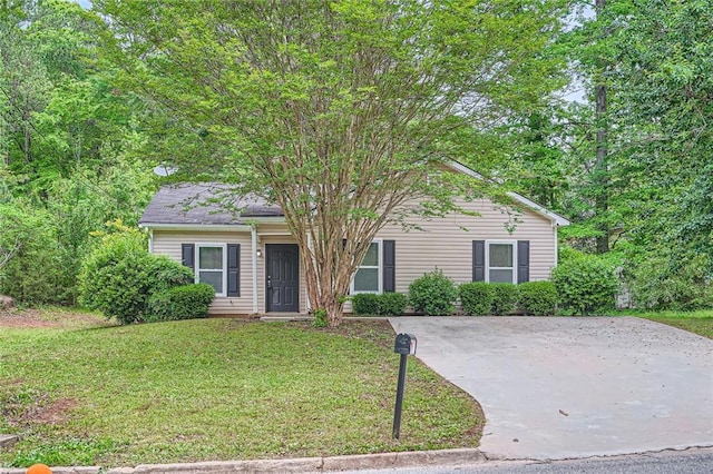 obstructed view of property with a front yard
