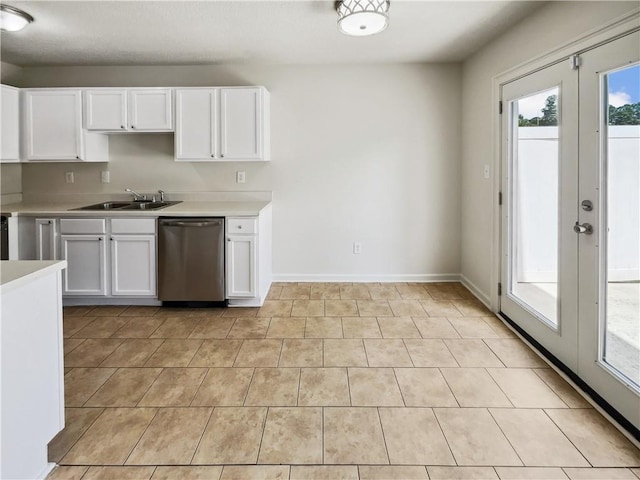 kitchen featuring white cabinetry, stainless steel dishwasher, sink, and french doors