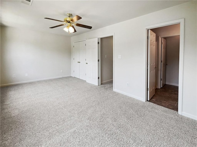 unfurnished bedroom with carpet floors, a closet, and ceiling fan