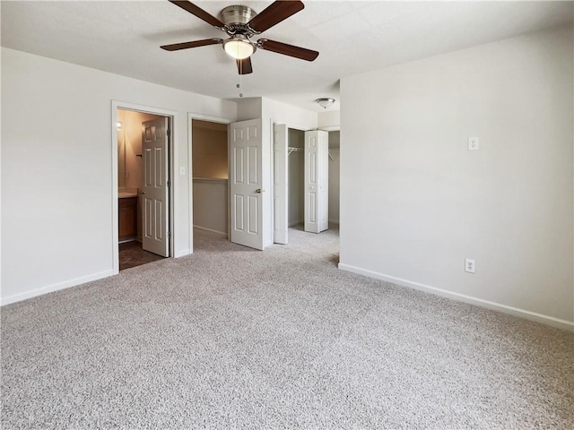 unfurnished bedroom with connected bathroom, light colored carpet, a closet, and ceiling fan