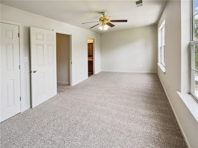 unfurnished room featuring carpet floors and ceiling fan