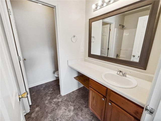 bathroom with vanity and toilet