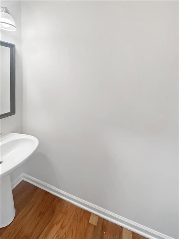 bathroom featuring wood-type flooring