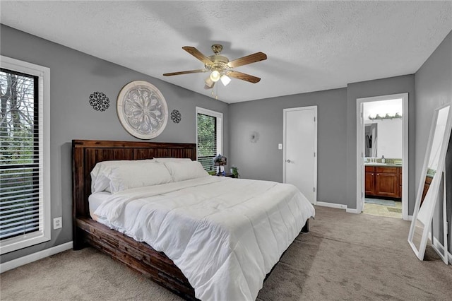 3906 Cedar Cir Unit 3906, Tucker, GA 30084 - bedroom with light colored carpet, a textured ceiling, ceiling fan, and ensuite bath