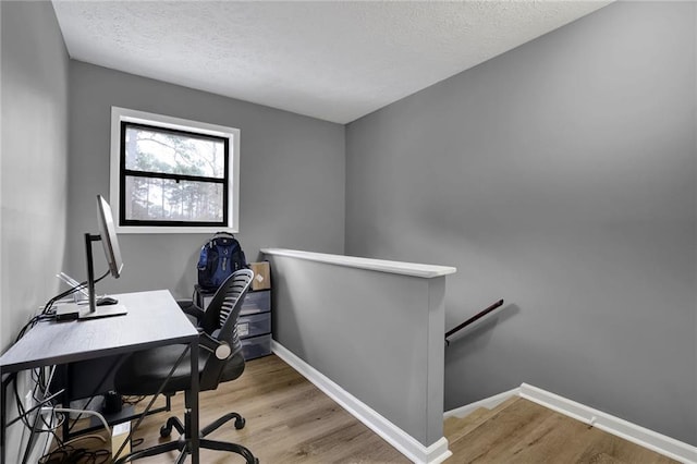 3906 Cedar Cir Unit 3906, Tucker, GA 30084 - home office with a textured ceiling and light wood-style flooring