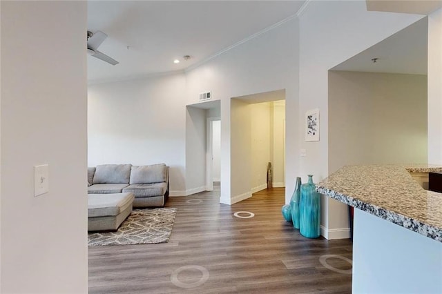 3275 Lenox Rd NE Unit 413, Atlanta, GA 30324 - living area with wood finished floors, ornamental molding, and recessed lighting