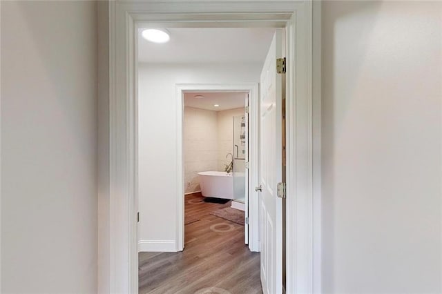 3275 Lenox Rd NE Unit 413, Atlanta, GA 30324 - hallway with light wood finished floors and baseboards