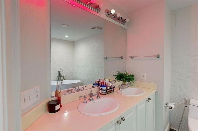 3275 Lenox Rd NE Unit 413, Atlanta, GA 30324 - bathroom featuring a soaking tub and double vanity