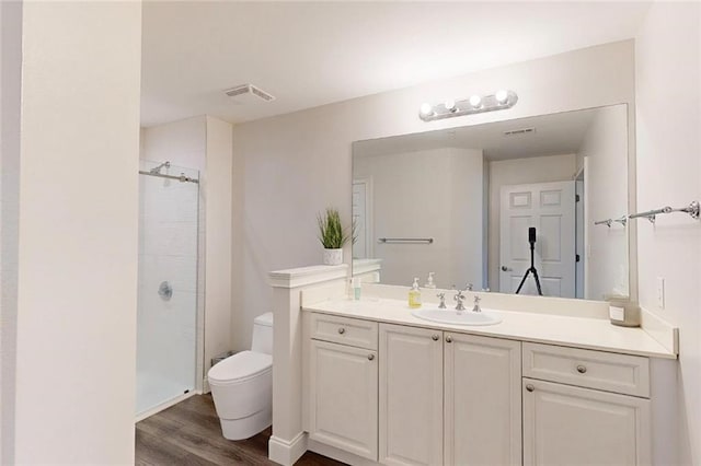 3275 Lenox Rd NE Unit 413, Atlanta, GA 30324 - bathroom with vanity, a shower stall, and wood finished floors