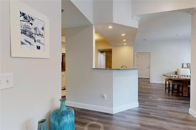 3275 Lenox Rd NE Unit 413, Atlanta, GA 30324 - kitchen with dark wood-style flooring, recessed lighting, and stone countertops