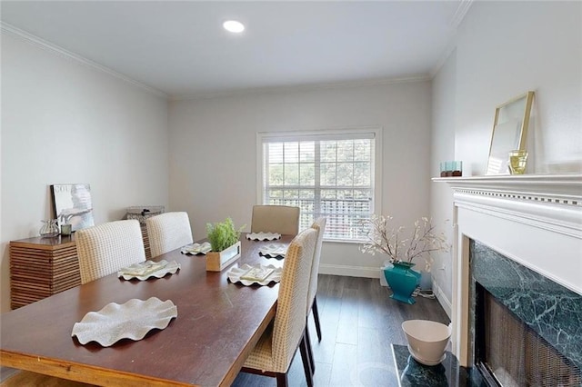 3275 Lenox Rd NE Unit 413, Atlanta, GA 30324 - dining space featuring a fireplace with flush hearth, wood finished floors, crown molding, and recessed lighting
