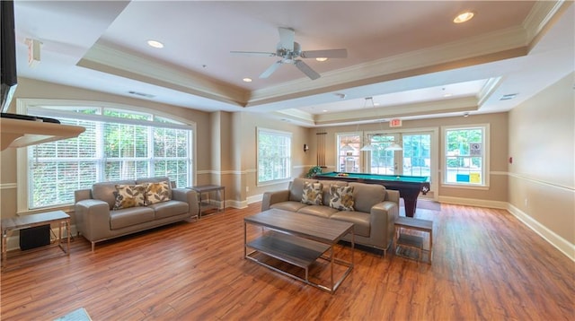 3275 Lenox Rd NE Unit 413, Atlanta, GA 30324 - living area featuring a tray ceiling, wood finished floors, billiards table, healthy amount of natural light, and crown molding