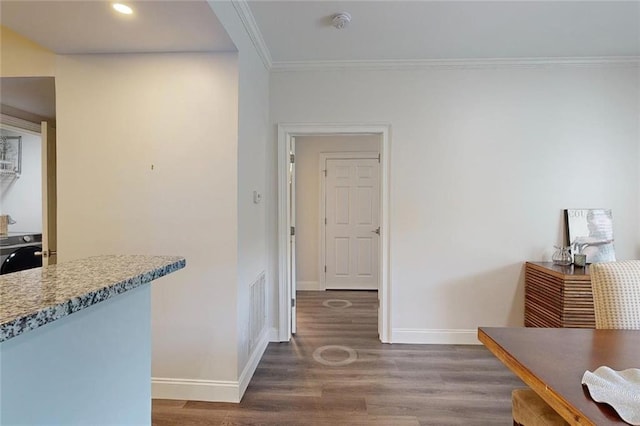 3275 Lenox Rd NE Unit 413, Atlanta, GA 30324 - hallway with washer / dryer, wood finished floors, crown molding, and recessed lighting